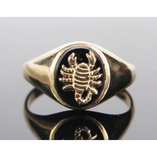 170 - A Gent's 9ct Gold and Onyx Scorpio Ring, hallmarked, size T.75, 3.48g