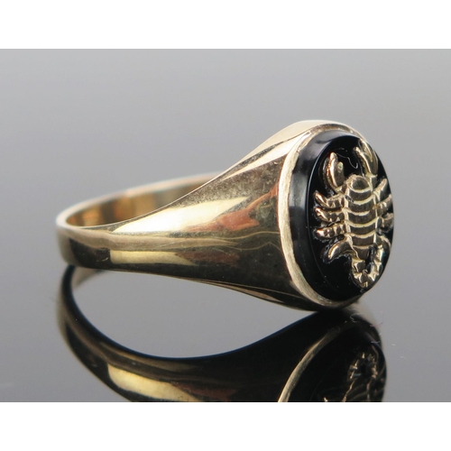 170 - A Gent's 9ct Gold and Onyx Scorpio Ring, hallmarked, size T.75, 3.48g