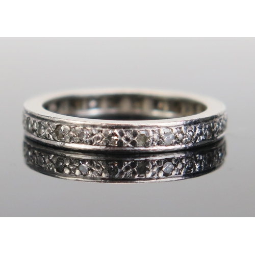 174 - A Platinum and Diamond and Diamond Eternity Ring, stamped PLAT, 3mm wide, size N.25, 5.43g