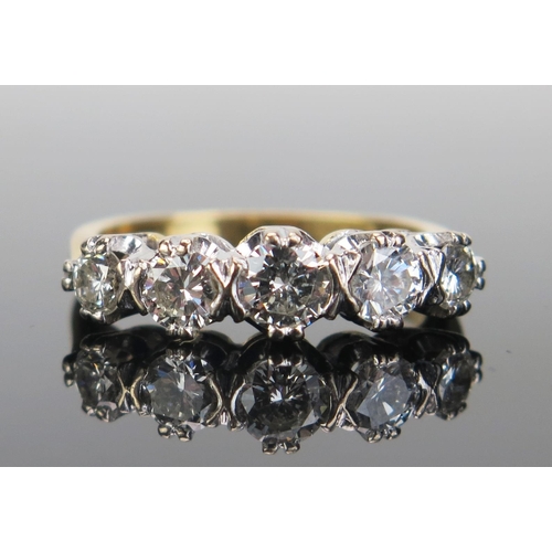 179 - An 18ct Gold and Diamond Five Stone Ring, the brilliant round cuts measuring 5.3, 2x4.1 and 2x3.3mm,... 