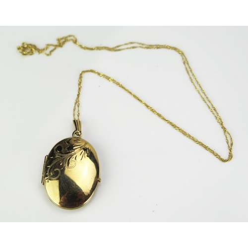 186 - A 9ct Gold Locket with chased foliate decoration, c. 34mm drop (continental marks) and on a 9ct gold... 