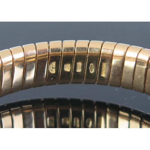 190 - A BVLGARI Tubogas 18ct Gold and Onyx Torque Bangle , full marks, steel spring core, 35.65g