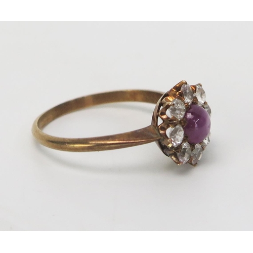 195 - A Star Ruby and White Sapphire Star Ring in an unmarked precious yellow metal setting, 11mm head, KE... 