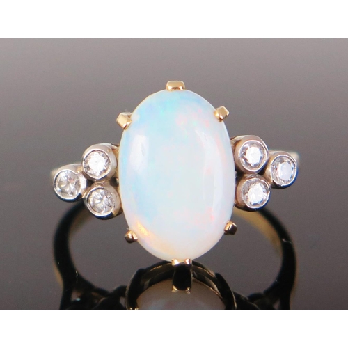 196 - An 18ct Gold, Opal and Diamond Ring, 12.5x8.5mm central stone flanked by three c, .2mm diamonds in r... 