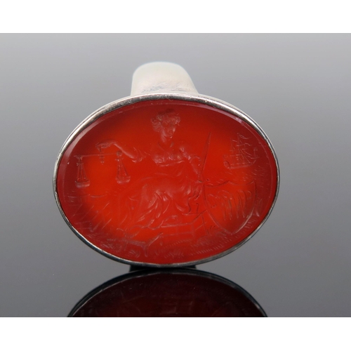 202 - A Large Carnelian Seal Ring in an unmarked precious white metal mount, the 28x21.5mm matrix profusel... 