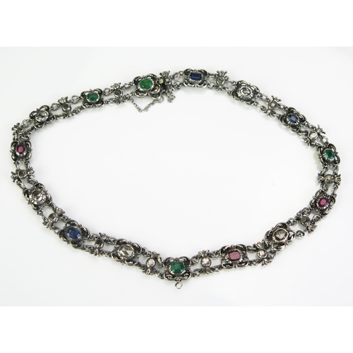 218 - An Antique Diamond, Emerald, Ruby and Sapphire Choker in a precious white metal setting with old ros... 