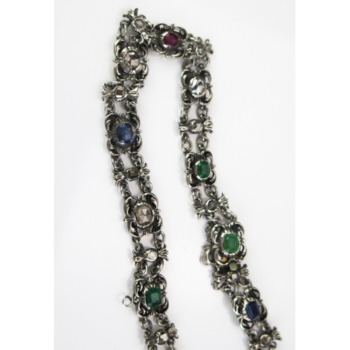 218 - An Antique Diamond, Emerald, Ruby and Sapphire Choker in a precious white metal setting with old ros... 