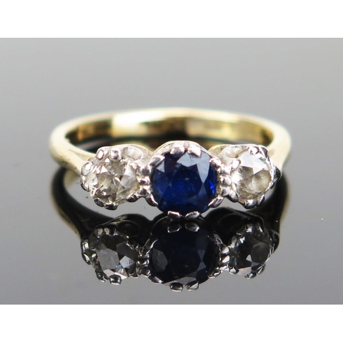 227 - An 18ct Gold and Platinum, Sapphire and Diamond Three Stone Ring, stamped marks, size H.5, 2.69g. So... 