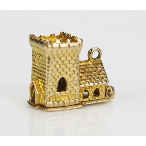 235 - A 9ct Gold Wedding Charm in the form of a church with hinged top opening to reveal the bride and gro... 