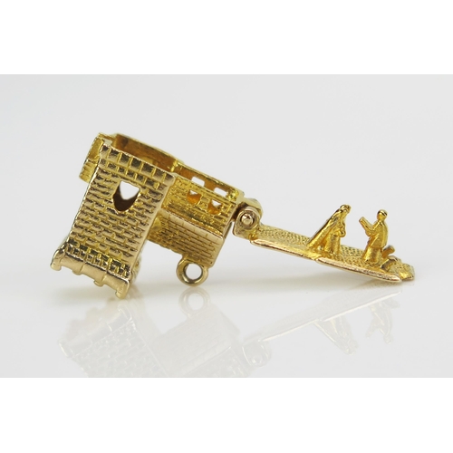 235 - A 9ct Gold Wedding Charm in the form of a church with hinged top opening to reveal the bride and gro... 