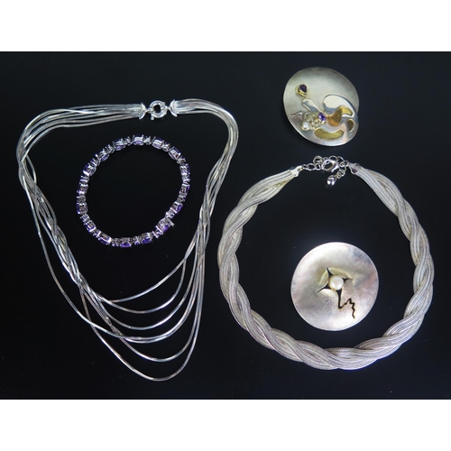 239 - Two Hand Made Silver Brooches (largest 54mm diam.), silver necklace, silver bracelet and white metal... 