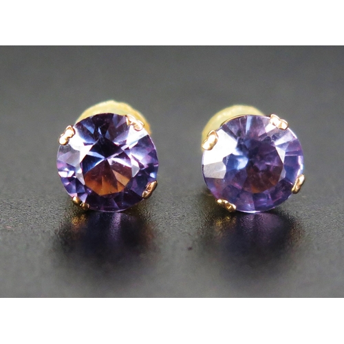 244 - A Pair of Amethyst Stud Earrings in a precious yellow metal setting, 8mm diam., KEE tested as 14ct, ... 