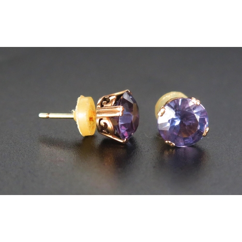 244 - A Pair of Amethyst Stud Earrings in a precious yellow metal setting, 8mm diam., KEE tested as 14ct, ... 