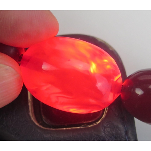 274 - A Faux Cherry Amber Graduated Bead Necklace, 29