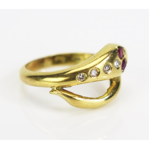 28 - An 18ct Gold, Ruby and Diamond Snake Ring, import marks, c. 2.5mm rubies and largest diamond c. 1.3m... 