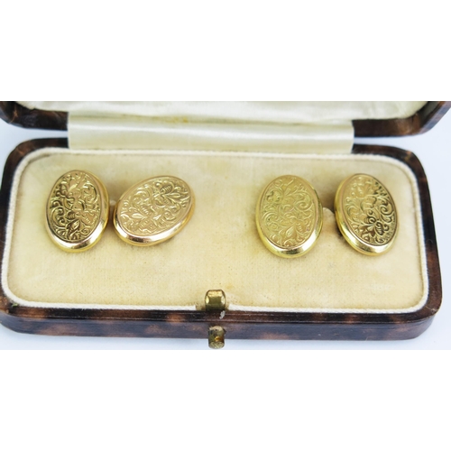 414 - An Antique Pair of 15ct Gold Oval Cufflinks with chased scrolling foliate decoration, Birmingham 190... 