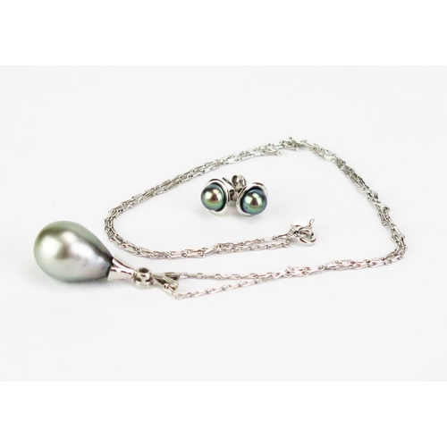 416 - An untested South Sea Pearl and Diamond Pendant in a 9ct white gold hallmarked setting (30mm drop) a... 