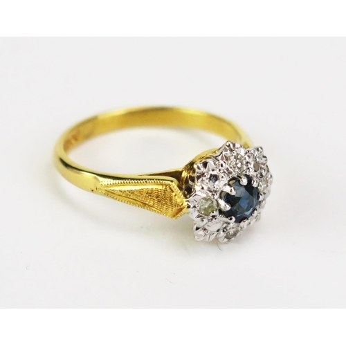 417 - An 8ct Gold, Sapphire and Diamond Cluster Ring, c. 11mm head, hallmarked, size M.5, 3.79g