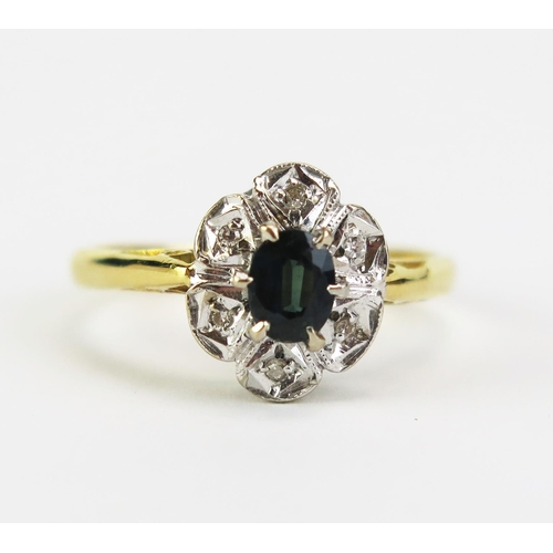 421 - An Emerald and Diamond Cluster Ring, 11x9mm head, hallmarked, size M.5, 3.28g