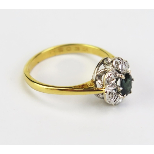 421 - An Emerald and Diamond Cluster Ring, 11x9mm head, hallmarked, size M.5, 3.28g