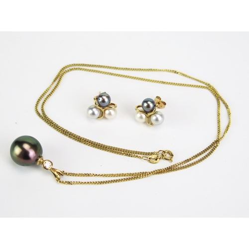 422 - A 9ct Gold, untested South Sea Pearl and Diamond Pendant, 23mm drop, hallmarked, on a 9ct gold chain... 