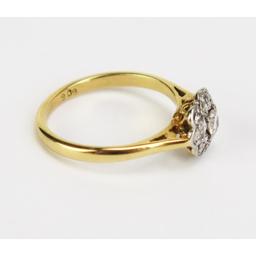 423 - An 18ct Gold and Diamond Cluster Ring, 8.5mm platinum head, hallmarked, size K.5, 2.83g