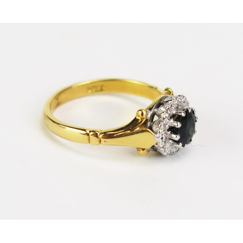 424 - An 18ct Gold, Sapphire and Diamond Cluster Ring, 9mm head, stamped 18CT, size L, 4g