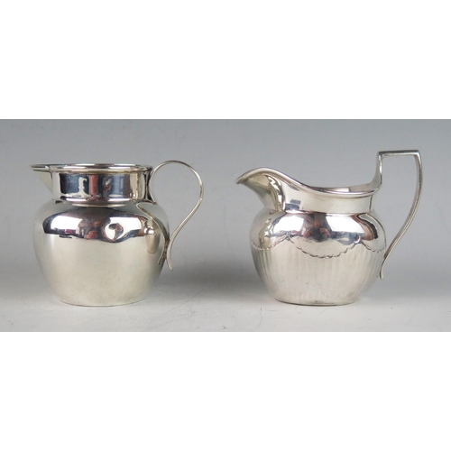 503 - A Victorian silver cream jug, maker's mark worn, London, 1878, of ovoid form, with half reeded decor... 