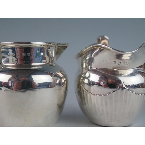 503 - A Victorian silver cream jug, maker's mark worn, London, 1878, of ovoid form, with half reeded decor... 