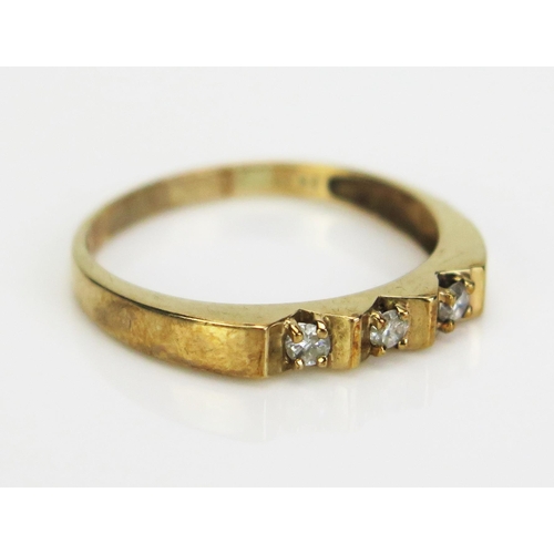 58 - A 9ct Gold and Diamond Three Stone Ring, continental marks, stamped 21PT, size X.5, 2.94g