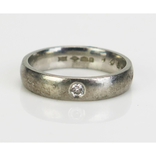 65 - A Platinum and Diamond Plain Band, stamped 