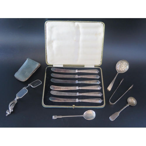 703 - A mixed collection of silver and plated wares including six silver handles butter knives, cased, spo... 