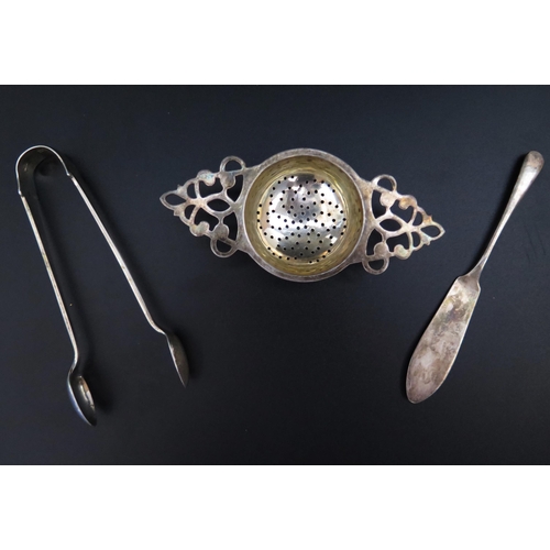 724 - A George V Silver Tea Strainer (Birmingham 1919), London silver sugar tongs and Sheffield silver but... 