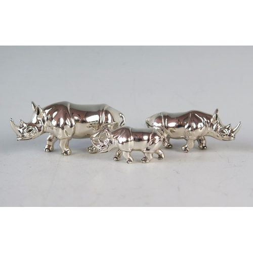 734 - A QEII Silver Family of Three Rhinoceros, largest 6cm long, Sheffield marks, Mark Houghton Ltd.,63.4... 