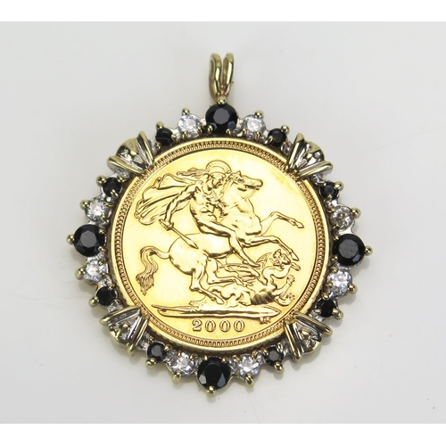 74 - A QEII Gold Half Sovereign in an unmarked yellow metal and stone set pendant mount, 6.52g