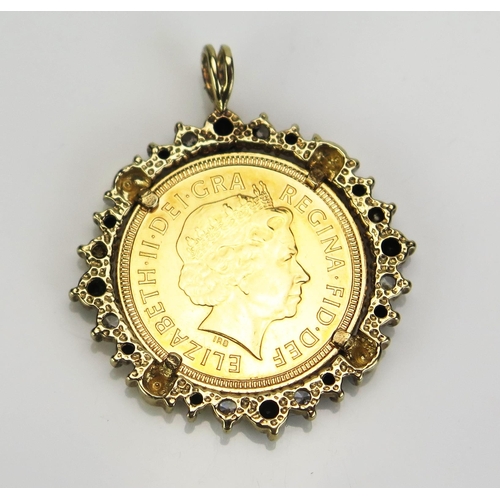 74 - A QEII Gold Half Sovereign in an unmarked yellow metal and stone set pendant mount, 6.52g