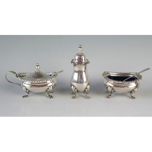 743 - A QEII Silver Three Part Cruet Set, Birmingham 1973, Barker Ellis Silver Co., 129.9g and one silver ... 