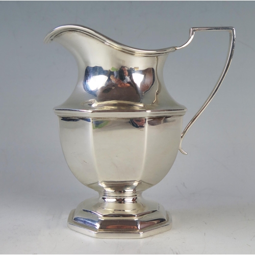 757 - A George V silver pedestal cream jug, maker Thomas Bradbury & Sons Ltd, London, 1927, of octagonal f... 