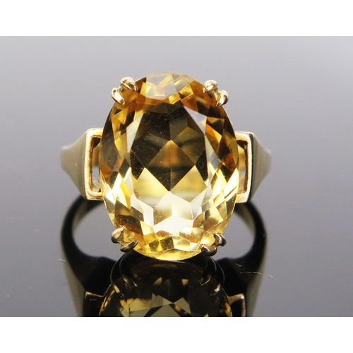 78 - A 9ct Gold and Citrine Dress Ring, 16x12mm stone, stamped 9CT, size M.5, 5.14g