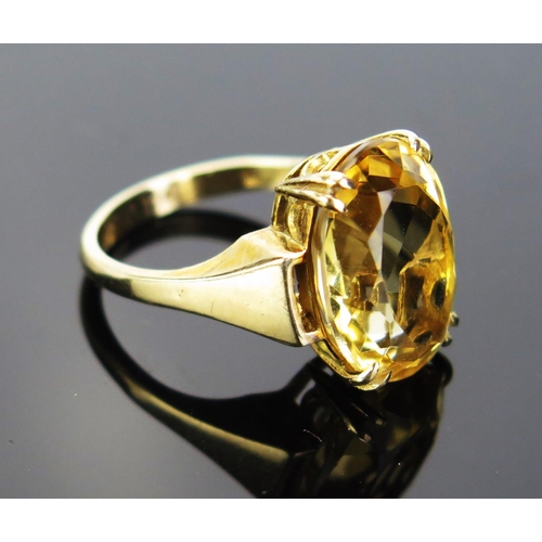 78 - A 9ct Gold and Citrine Dress Ring, 16x12mm stone, stamped 9CT, size M.5, 5.14g