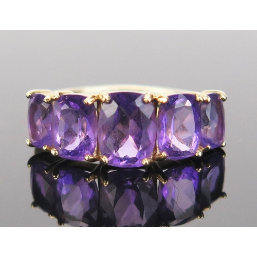 79 - A 9ct Gold and Amethyst Five Stone Ring, 21.5x8mm head, continental marks, size O.5, 3.02g