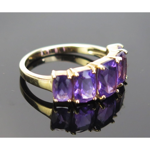 79 - A 9ct Gold and Amethyst Five Stone Ring, 21.5x8mm head, continental marks, size O.5, 3.02g