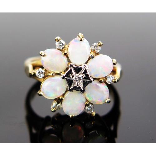 80 - A 9ct Gold, Opal and Diamond Cluster Ring, 16mm head, hallmarked, 4.17g