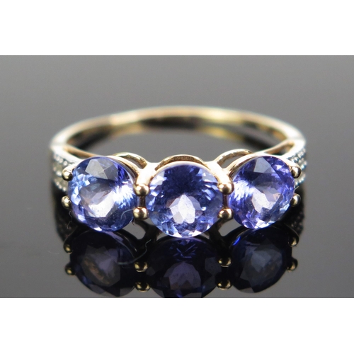 86 - A 10K Gold, Tanzanite and Diamond Dress Ring, stamped 10K, 9ct hallmarked, size R.25, 2g