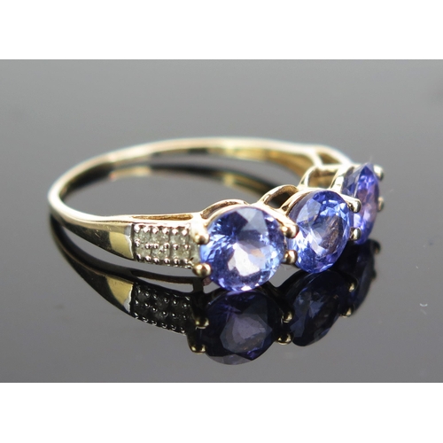 86 - A 10K Gold, Tanzanite and Diamond Dress Ring, stamped 10K, 9ct hallmarked, size R.25, 2g