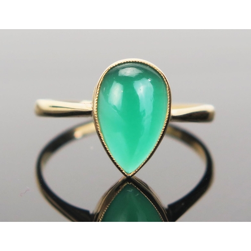 95 - An 18ct Gold and Green Agate Ring, millegrain set teardrop shape, stamped 18CT, size Q.5, 2.3g