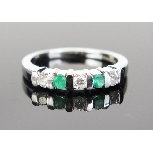 96 - An 18ct White Gold, Emerald and Diamond Five Stone Ring, c. 2.8mm stones, hallmarked, size M.25, 3.7... 