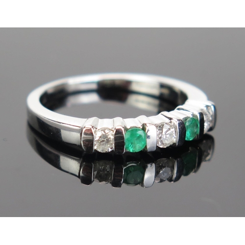 96 - An 18ct White Gold, Emerald and Diamond Five Stone Ring, c. 2.8mm stones, hallmarked, size M.25, 3.7... 