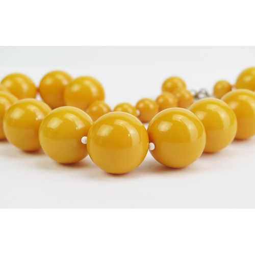 273 - A Faux Baltic Amber Necklace with Kenneth Lane Tag, largest 21.5mm, c. 17