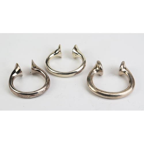 706 - Three white metal amulets, of traditional design,  179gms 5.75ozs